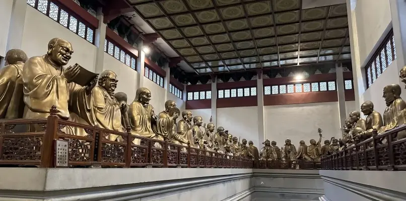 Hall of 500 Arhats at Lingyin Temple featuring lifelike bronze Buddhist statues
