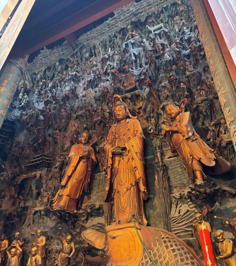 Relief carvings inside the Mahavira Hall of Lingyin Temple showing Buddhist motifs