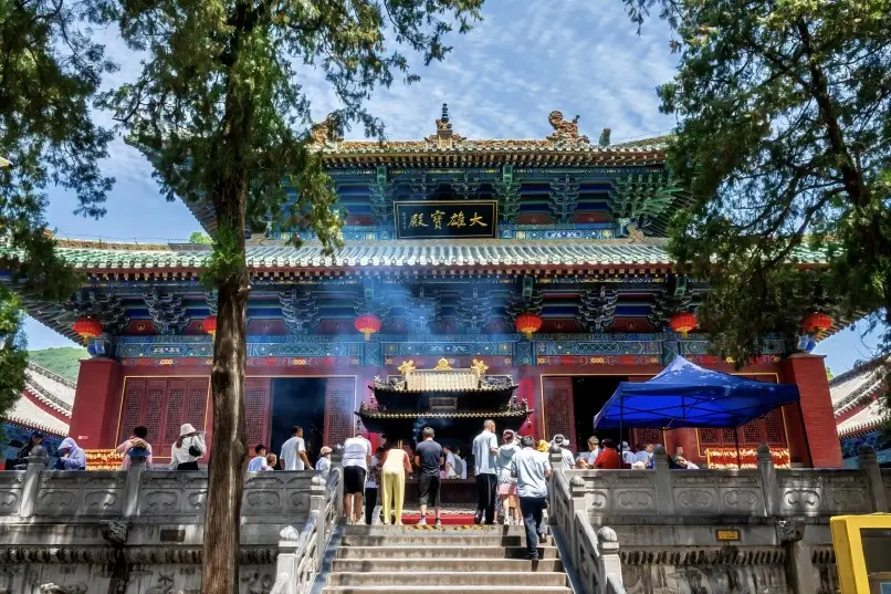 Worshippers lighting incense at Mahavira Hall inside Shaolin Temple, Henan