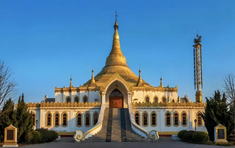 Thai-style Buddhist temple at White Horse Temple, known for its golden architecture