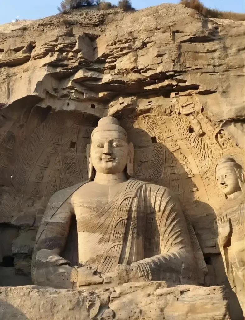 Yungang Grottoes 17-meter-tall outdoor Buddha statue in Datong, showcasing exquisite 5th-century Buddhist art.