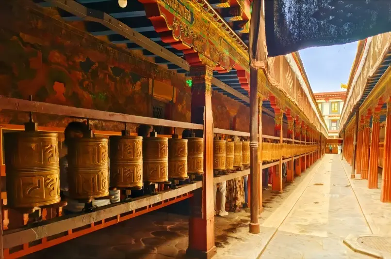 Tibetan prayer wheels along the circumambulation path (kora) around Potala Palace in Lhasa.