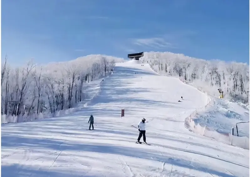 Skiers enjoying winter sports at Yabuli Ski Resort near Harbin