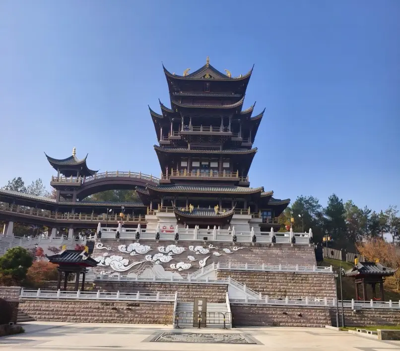 Yiwu Jiming Pavilion on a sunny day, offering panoramic views of the city.