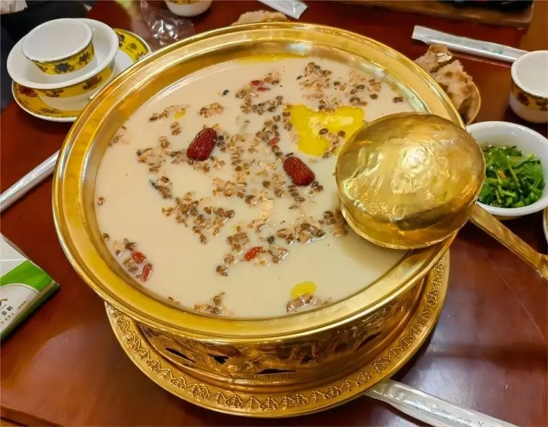 A pot of Tibetan butter tea, a salty and creamy beverage enjoyed by locals.