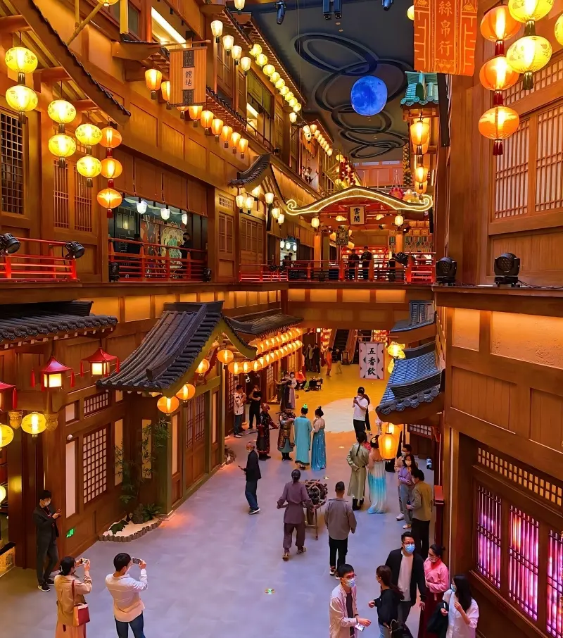 Visitors walking through Chang’an Twelve Hours Theme Street in Xi’an experiencing immersive Tang Dynasty streets