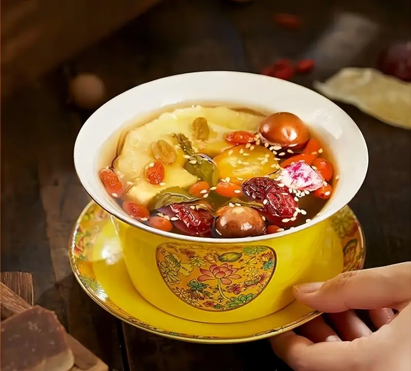 A cup of Eight-Treasure Tea, a sweet and fragrant tea made with longan, red dates, goji berries, and other natural ingredients.