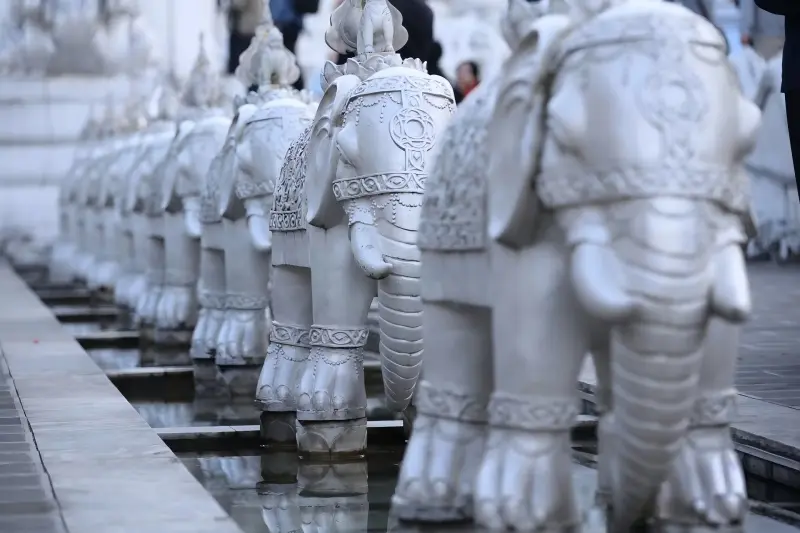 Close-up detail of Menghuan Silver Pagoda in Mangshi showing elegant architecture.