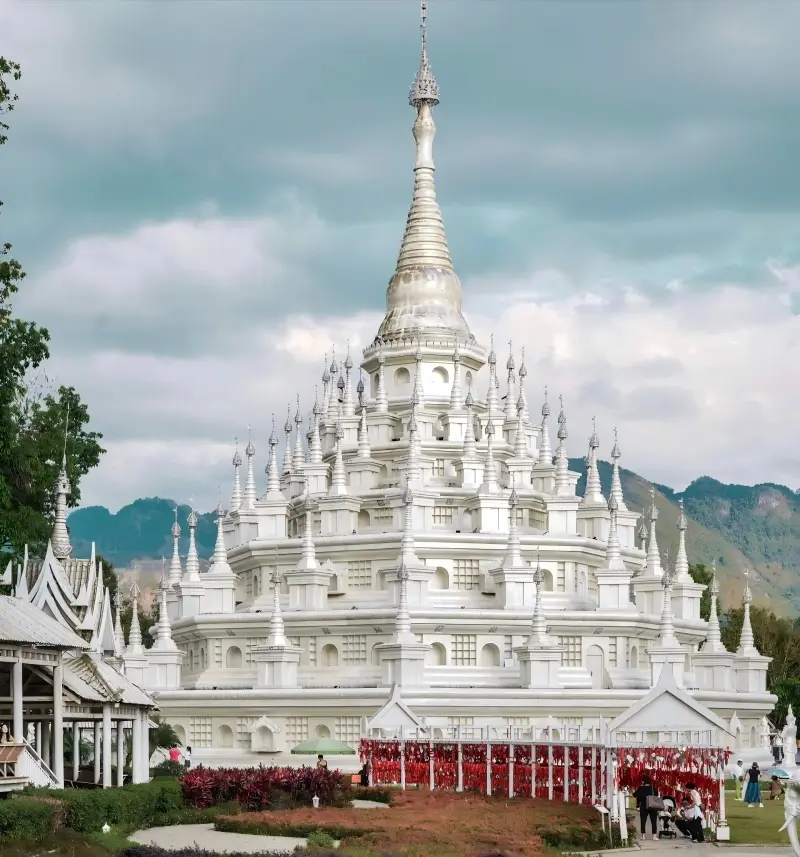 Panoramic view of Menghuan Silver Pagoda in Mangshi, a beautiful white Buddhist tower.