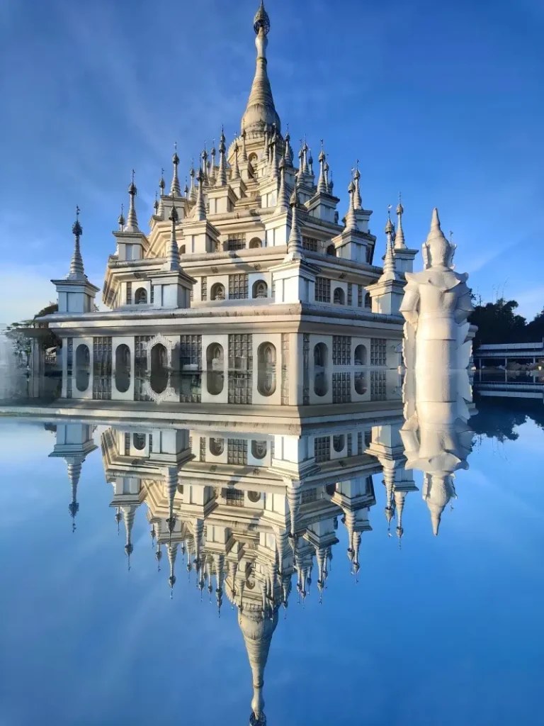 Reflection view of Menghuan Silver Pagoda in Mangshi with its mirror pool.