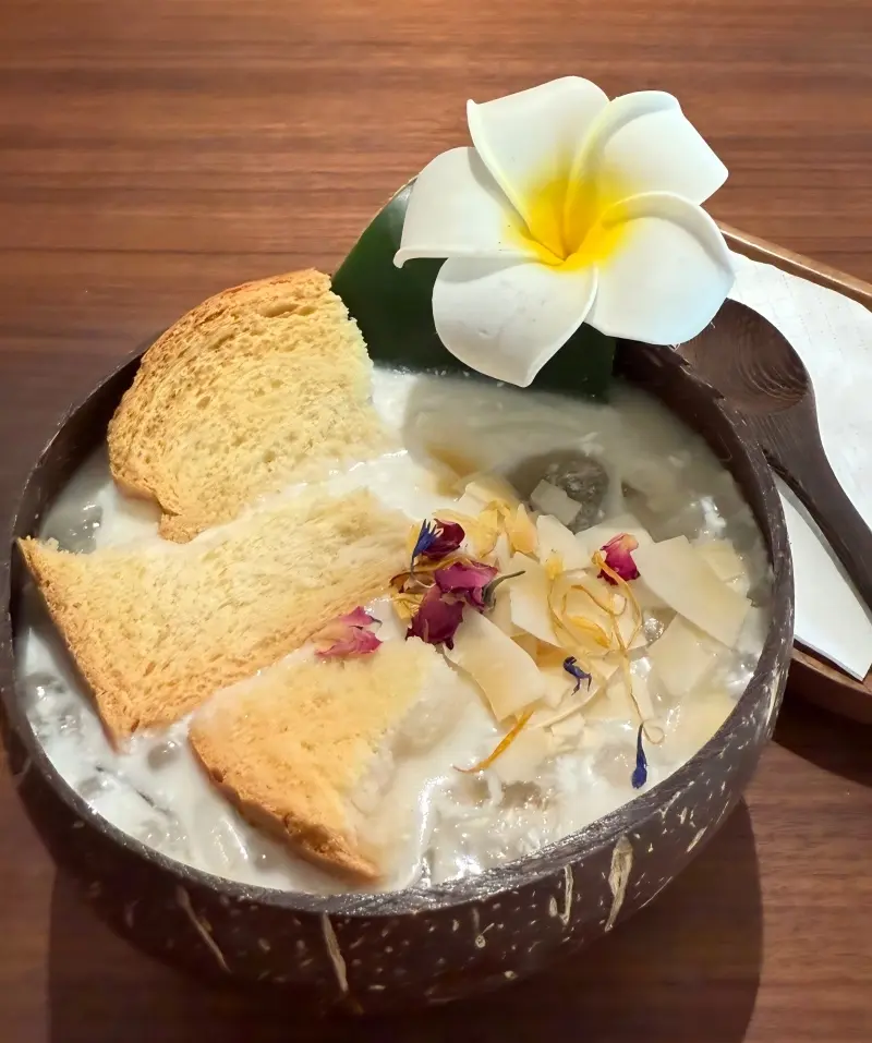 Paoluda dessert drink in Mangshi made with coconut milk, bread, fruit, and tapioca.