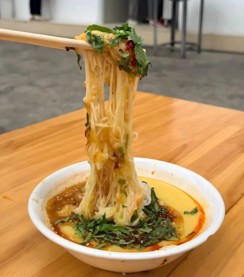Rice noodles with pea paste in Mangshi, a popular local breakfast dish.