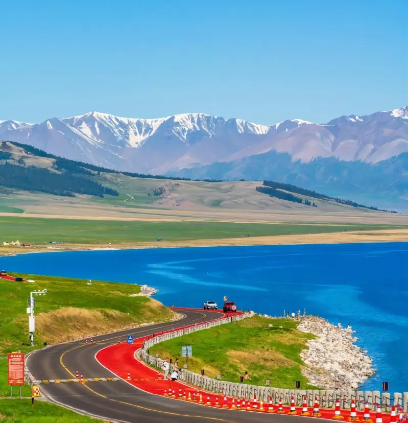 Scenic view of Sailimu Lake from nearby road, clear sunny day, Xinjiang, China