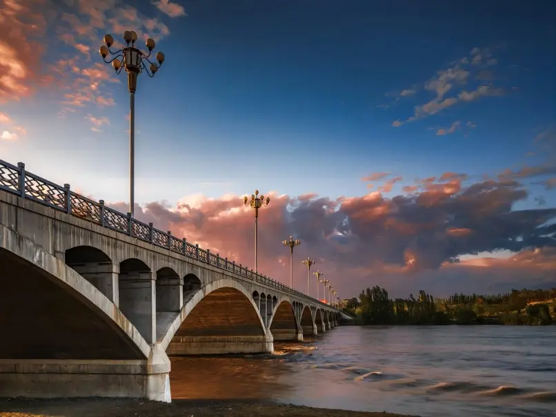 Yili River Scenic Area bathed in soft sunrise or sunset glow, Yining, Xinjiang