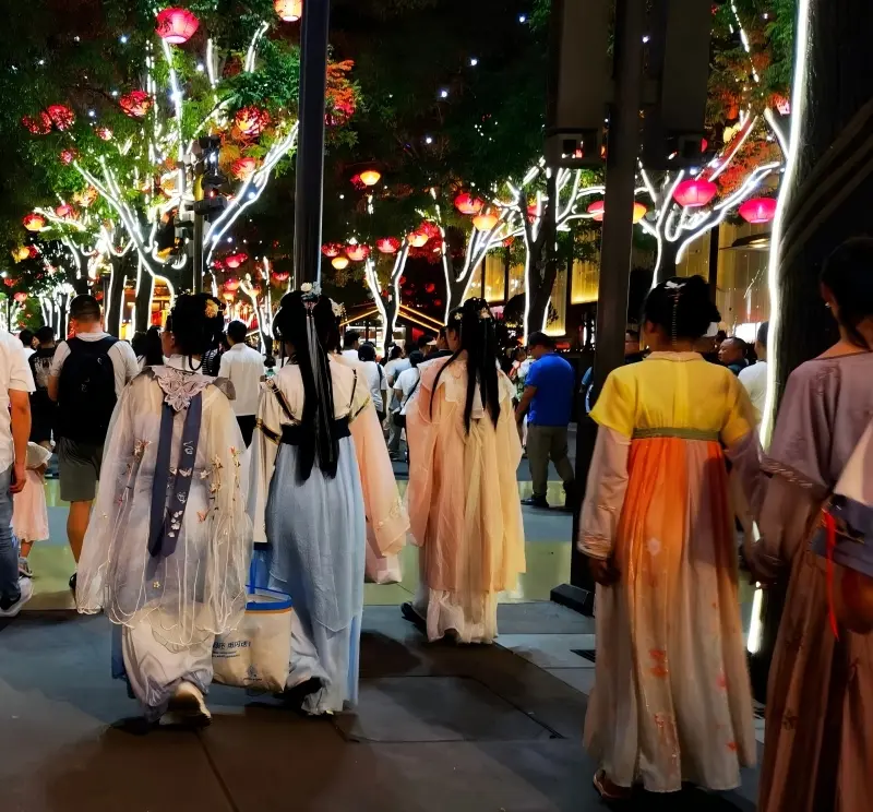 Tourists wearing Hanfu at Datang Everbright City night street in Xi’an