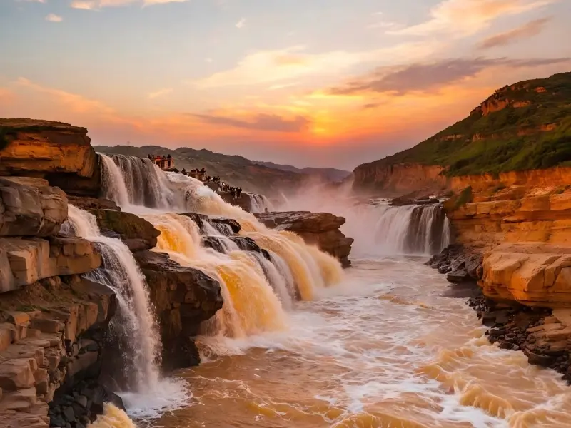 Golden-hour lighting highlights the immense power and beauty of Hukou Waterfall.