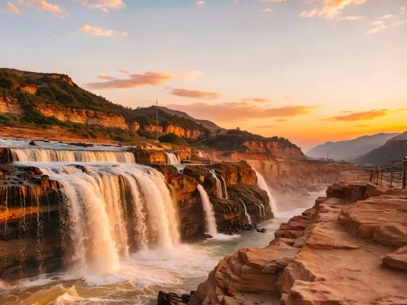 Warm evening colors enhance the dramatic scenery surrounding Hukou Waterfall.