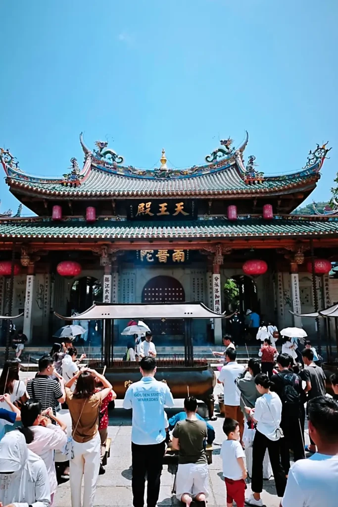 Worshippers praying at Nanputuo Temple in Xiamen, China