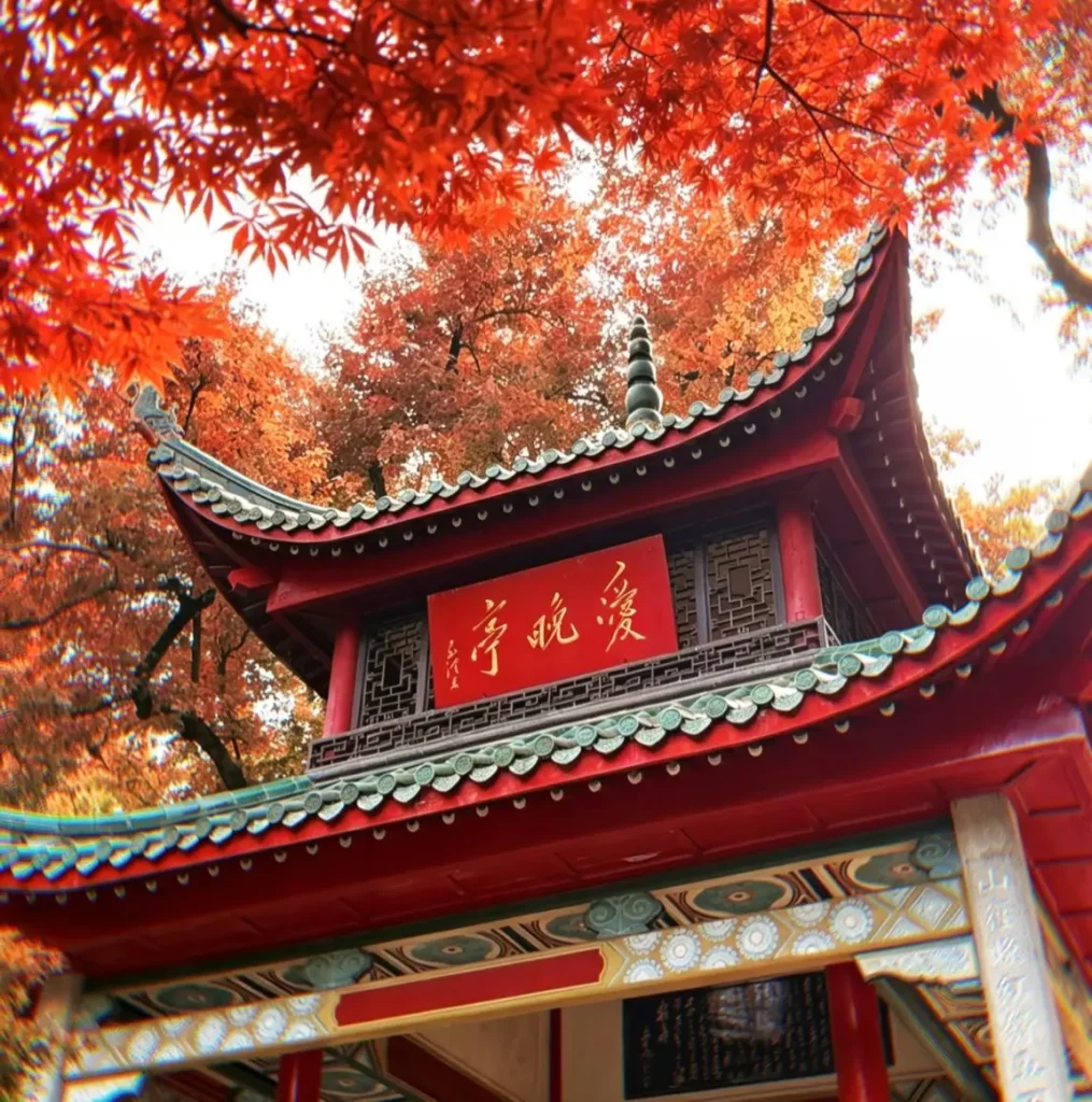 Aiwan Pavilion on Yuelu Mountain surrounded by red autumn maple leaves in Changsha.