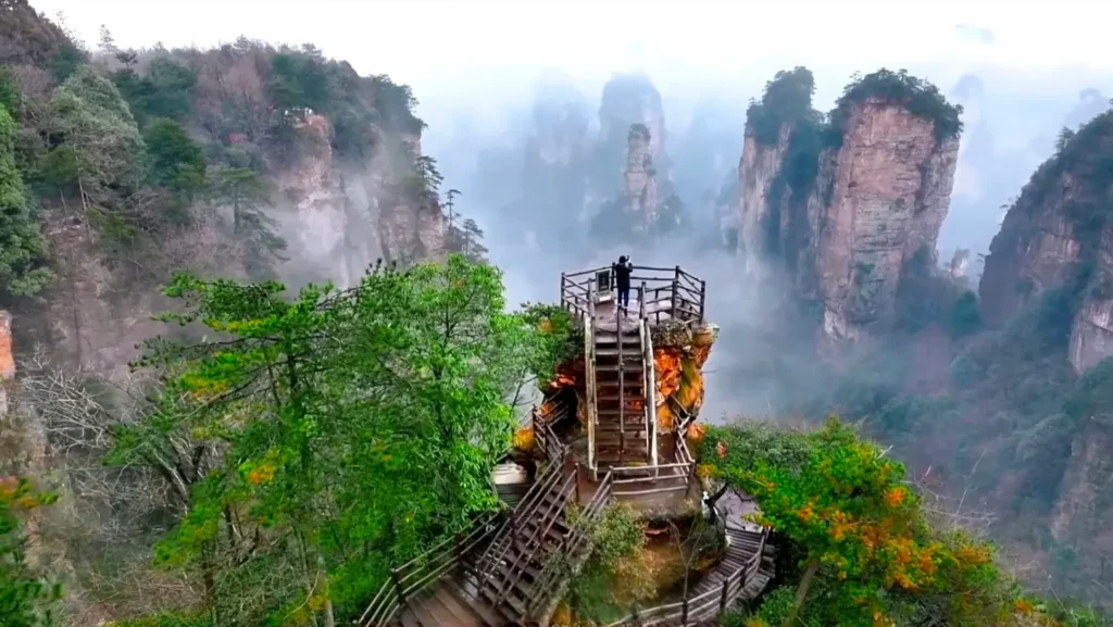 Tourists taking photos of the peak forest from Zhaixingtai (Star-Gathering Platform) in Huangshizhai.