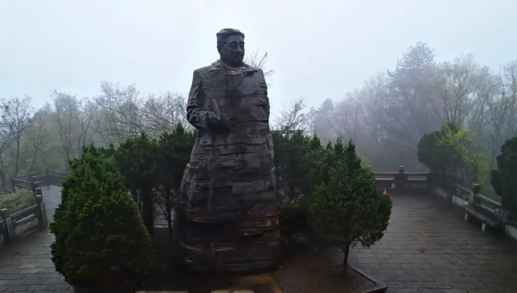 The 6.5-meter bronze statue of Marshal He Long overlooking the West Sea Peak Forest at Helong Park